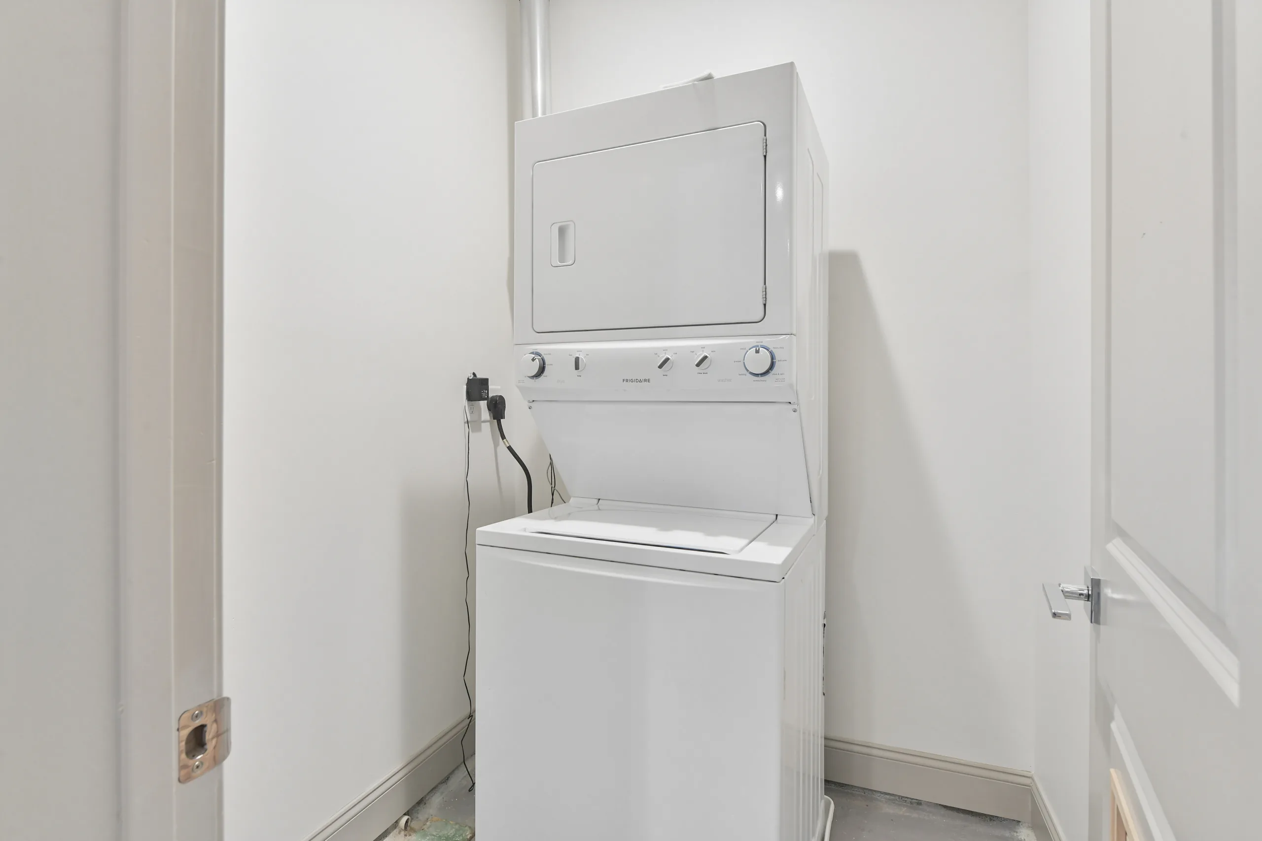 Stacked washer and dryer in-unit at 1580 River St #4D