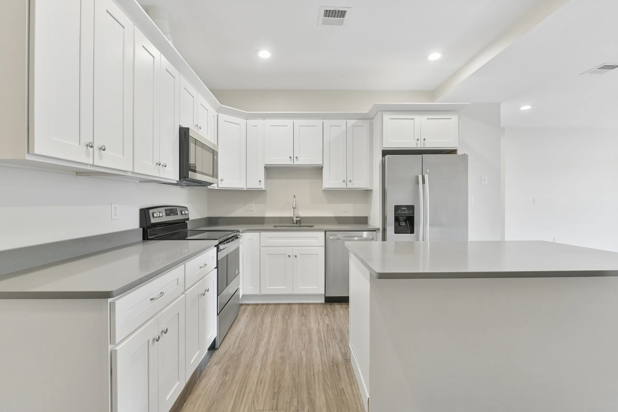 Kitchen with full-size range and dishwasher at 1580 River St #4D