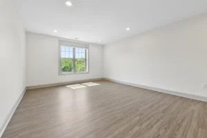 Living room with wide-plank flooring at 1580 River St #4D