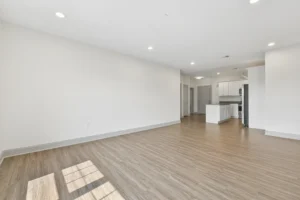 Open-plan living space looking toward the kitchen at 1580 River St #4D