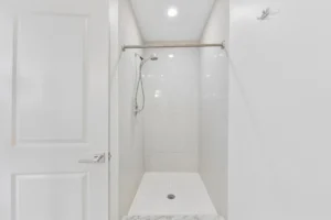 Tiled walk-in shower at 1580 River St #4D