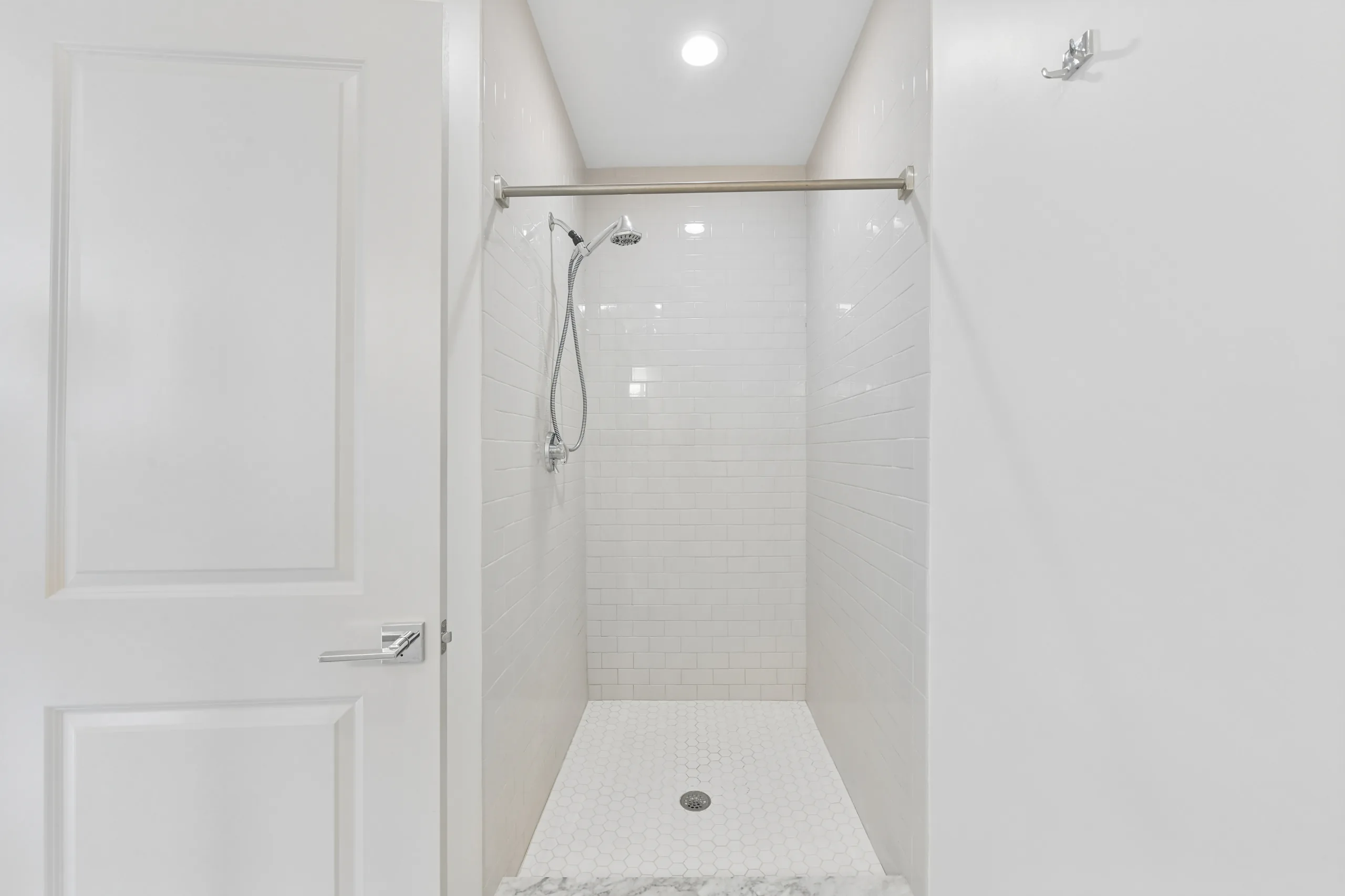 Tiled walk-in shower at 1580 River St #4D