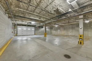 Covered garage parking at Thread Hyde Park, 1580 River St